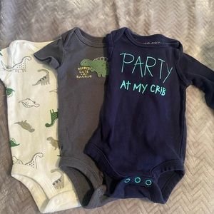 white, blue, and grey newborn onesies